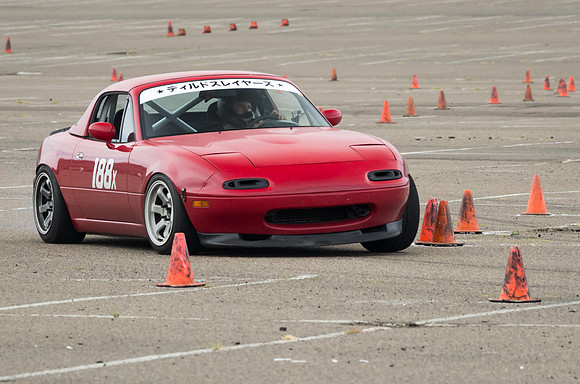 Red car threads the needle